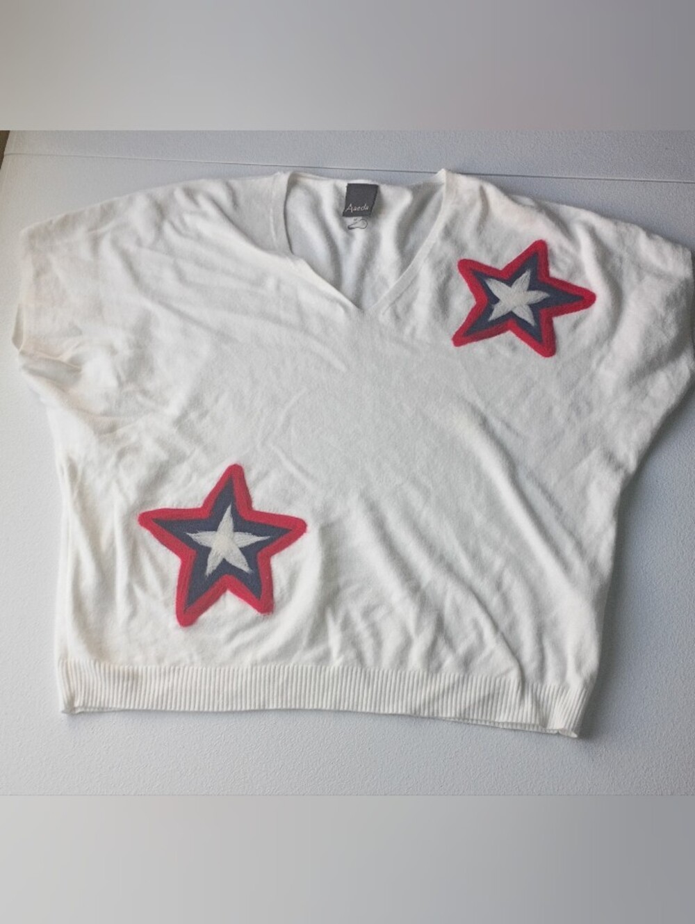Women's Aaeda White  V-Neck Sweater with Star Appliqués Size Medium